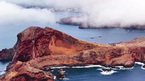 Madeira coastline showcasing rugged cliffs and blue waters of Portugal Stock Footage 319406106
