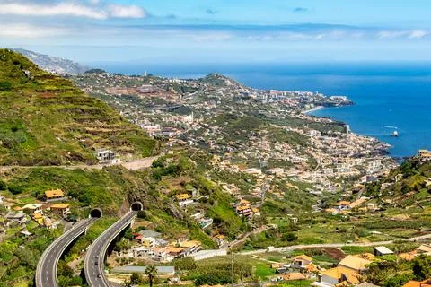 Madeira panoramic view from mountains down to coastal city Stock Photos
