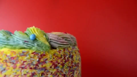 Madeira sponge coated with yellow colour frosting, layered with plum and rasp Stock Footage 161151054
