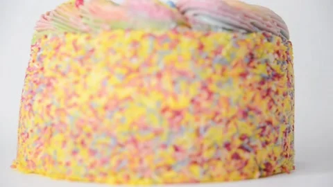 Madeira sponge coated with yellow colour frosting, layered with plum and rasp Stock Footage 161151059
