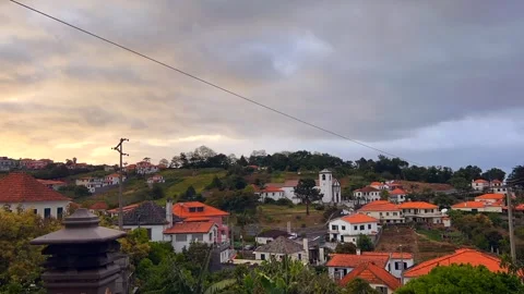 Madeira town sunset time lapse. Clouds above small town. Stock Footage 249014786