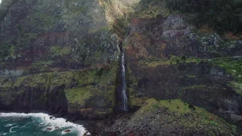 Madeira Waterfall is Cascading into the Ocean at the Cliffside Location Stock Footage 320789666