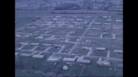 MADISON - 1974: Tornado Aftermath — Bare town blocks meet open farmland Stock Footage 342230813