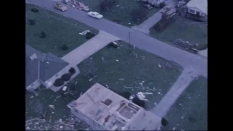 MADISON - 1974: Tornado Aftermath — Boom truck and torn warehouse roof Stockbeeldmateriaal 342230893