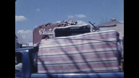 MADISON - 1974: Tornado Aftermath — Excavator swings past lettered church wall Видео 342230112
