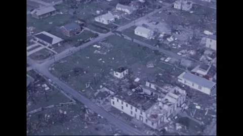 MADISON - 1974: Tornado Aftermath — Gutted center faces cleared rubble lot Stock Footage 342230896