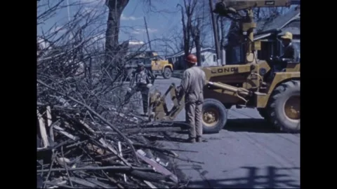 MADISON - 1974: Tornado Aftermath — Lettered backhoe works brush windrow Video stock 342230150