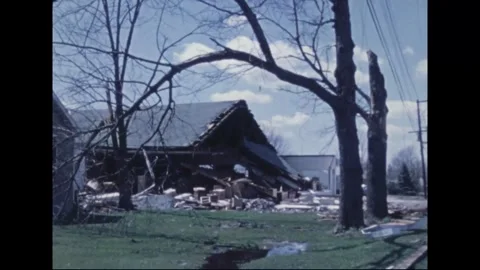 MADISON - 1974: Tornado Aftermath — Leveled block with poles across road Видео 342229990