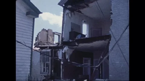 MADISON - 1974: Tornado Aftermath — Low angle on house exposed room by room Stock Footage 342229963