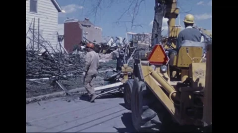 MADISON - 1974: Tornado Aftermath — Orange hard hats clear limbs and boards Stock Footage 342230148