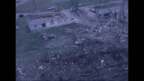 MADISON - 1974: Tornado Aftermath — Torn mobile home amid lumber tangles Stock Footage 342230884