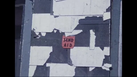 MADISON - 1974: Tornado Aftermath — Utility crew handles pole by stripped home Stock Footage 342230037