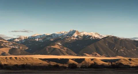 Madison Mountain Range as viewed from the valley near Ennis in late spring. Stock Photos