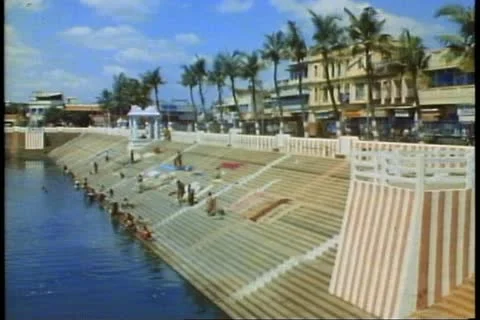 MADRAS, INDIA, 1982, A bathing and washing pool in Madras, with step stairs Stock Footage 10846152