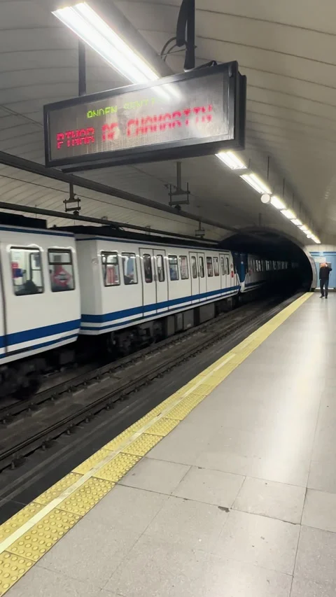 Madrid metro train leaving the platform and entering a dark tunnel Stock Footage 337067542