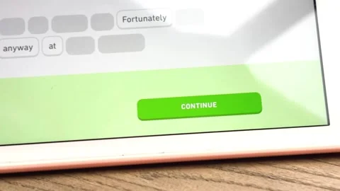 Madrid, Spain - 06/28/2024: Continue Button on the Duolingo Tablet App Stock Footage 278403001