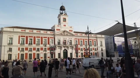 Madrid Spain Daytime Slow Pan of Real Casa de Correos Clock Tower and Crowds at Stock Footage 337936063