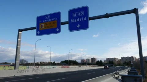 Madrid, Spain - Dec 5, 2021: Motorway sign heading towards Madrid, Spain. Sign Stock Footage 166498368