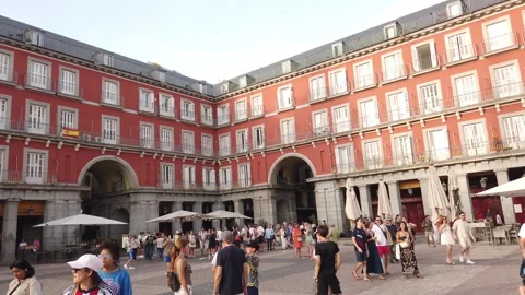 Madrid Spain Slow Landscape Pan of Crowded Square and Historic Red Facade Stock Footage 339034823