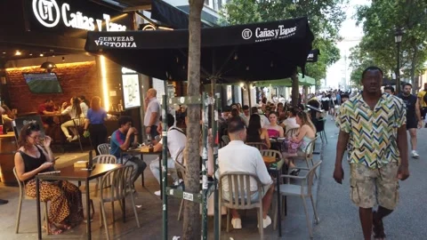 Madrid Spain Sunset Slow Pan View of Tapas Bar Outdoor Restaurant Patio Dining Stock Footage 337935756