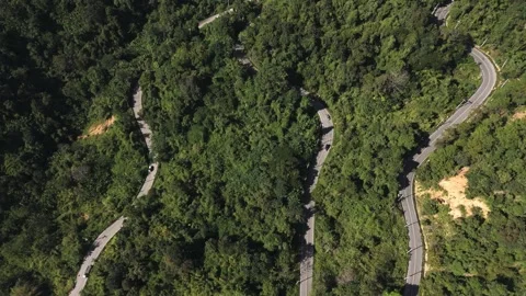 Mae Hong Son loop from above, curvy road in dense jungle Stock Footage 328848797