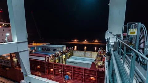 Maersk Containers Loading into Kornett Cargo Ship at Night Stock Footage 342146779