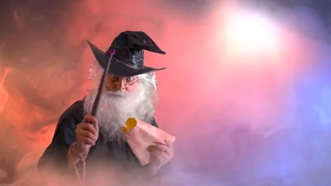 Mag 33Funny old man wizard magician Makes magic a magic wand Stock Footage 267087821