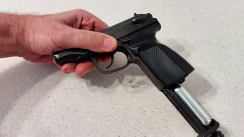 Magazine Ejection Demonstration with Black Semi-Auto Handgun 스톡 동영상 321999077