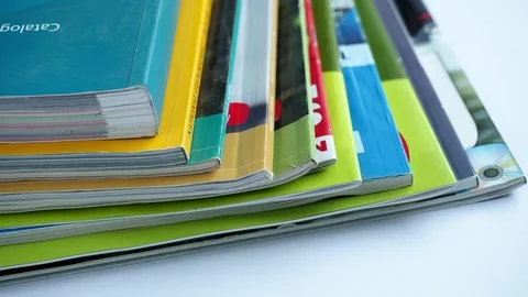 Magazines with selective focus on foreground edge. Video stock 87748928