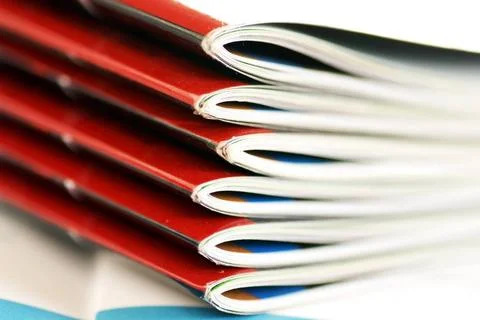 Magazines stack stack of same magazines with red covers closeup Copyright:... Stock Photos