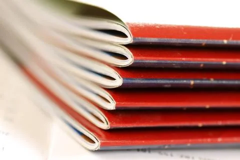 Magazines stack stack of same magazines with red covers closeup Copyright:... Foto stock