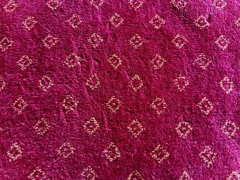 Magenta Carpet With Repeating Diamond Pattern Stock Photos