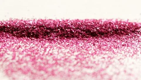 Magenta glitter on light background - macro photo Foto stock