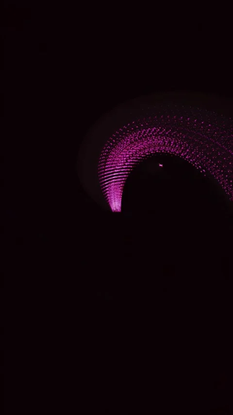 Magenta Particle Wave Vortex Flowing on Dark Background Vertical Seamless Loop 库存影片 343906329