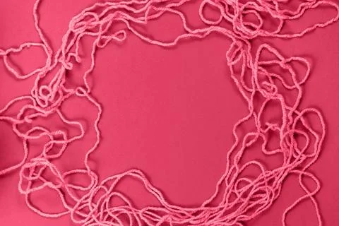 Magenta threads for creativity on a purple background Stock Photos