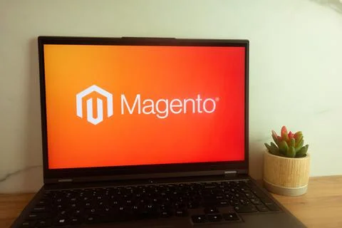 Magento e-commerce platform logo displayed on laptop Stock Photos