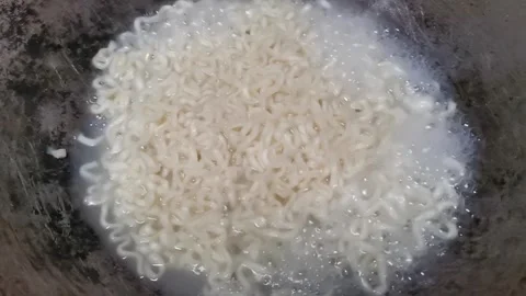 Maggi is being boiled on a frying-pan Stock Footage 321292716