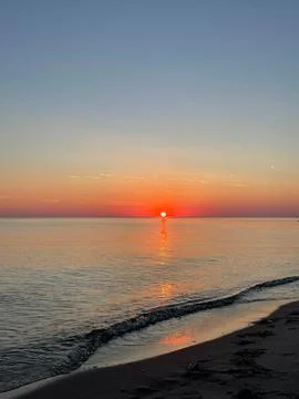 Magic Baltic Sunset: Tranquil Orange Sun Reflecting on the Waters of the Ba.. Stock Photos
