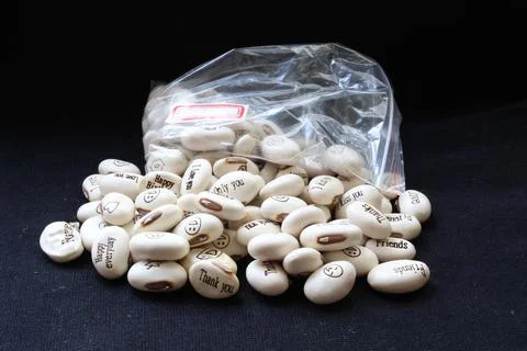 Magic beans. Beans with inscriptions. Beans with messages. Stock Photos