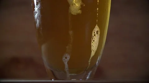 Magic bubbles in a glass of beer in slow mo Stock Footage 58926715