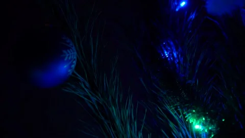 Magic close up a Christmas tree lights glittering at night. New Year fir tree Stock Footage 146095203