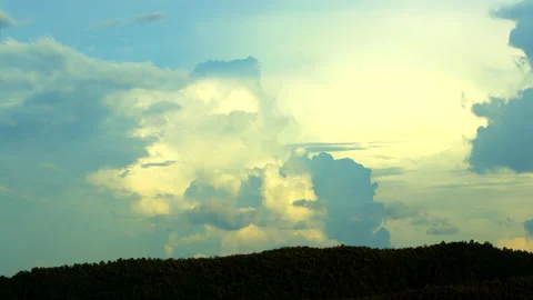 Magic clouds swirl over the mountain at sunset. Timelapse, relaxation weather Stock Footage 163030716