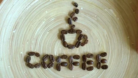Magic coffee beans. Look to the end. Creative video. Coffee beans on a table. 動画素材 69122714