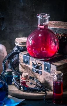 Magic concept. Red potion in bottle Stock Photos