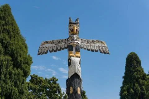 Magic creature bird with spread wings wooden totem at Victoria pablic park Stock Photos
