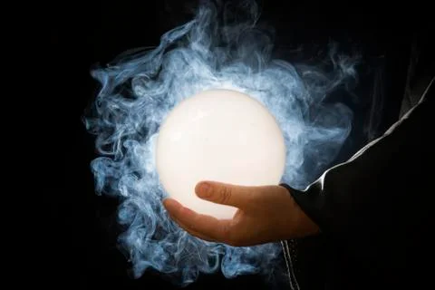 The magic crystal that was in the hands of the wizard That emitted light and  Stock Photos