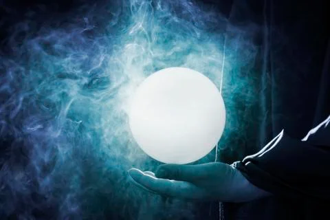 The magic crystal that was in the hands of the wizard That emitted light and  Stock Photos