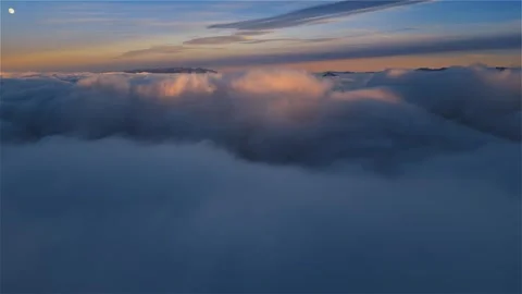 Magic evening above Misty clouds in mountains nature at sunset Stock Footage 293089020