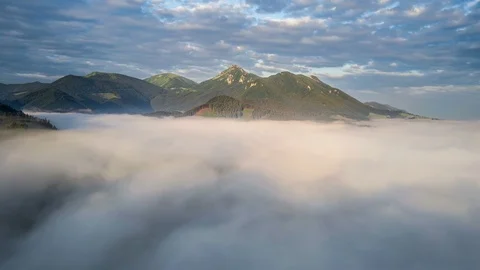Magic fly above clouds in green mountains Stock Footage 102264280