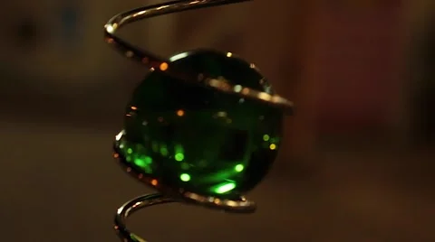 Magic green ball turning, spiral wire Stock Footage 57463512